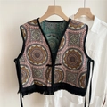 Detailed view of ethnic jacquard pattern vest with black tassel fringe and tie closure - Sunflower Embroidery / 46x46cm