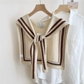 Detail of beige knit shawl with brown stripes and visible brand tag on a white shirt - Beige with Double Stripes