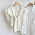 Dettaglio scialle in maglia bianca con trama in rilievo e bordo a costine - 44*100cm / Bianco latte con trama a fiocco
