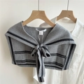 Detail view of grey striped knitted shawl scarf with material tag and bow-knot closure - 44X100CM / Black with Gray Stripes