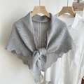 Close-up of grey hollow-out knit shawl with knotted front and scalloped edge detail - Grey Heart Pattern Scalloped Edge