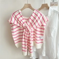 Detail of pink and white striped knit shawl with knot design on a white shirt - 2mikai Monroe Striped Pink / 50*100cm