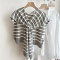 Detail showing grey and white striped knit shawl with a knot design over a white shirt - 3mikai Monroe Striped Gray / 50*100cm