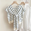 Close-up of blue and white striped knit shawl knotted over a white cotton shirt - 4mikai Monroe Striped Blue / 50*100cm
