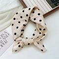 French retro beige polka dot cotton hair scarf tied in a bow on a wooden tray - Polka Dot Beige