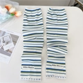 Detail of striped knitted arm sleeves with delicate lace trim and brand woven label - Blue Multi-Striped Lace Style