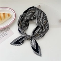 Pleated square scarf in black and white with golden baroque patterns tied in a knot - Black Grey Paisley Border