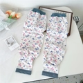 Detailed view of floral pattern cooling sleeves with elastic cuffs on a white desk - Pink and Blue Floral (3 Simple-Pink Blue Flower)