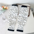 Detail of floral printed cooling arm sleeves with elastic cuffs and stitching - Tiny Floral (9 Simple-Weed)