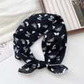 Chic black cotton scarf with white butterfly print in a stylish flatlay arrangement - Black Butterfly Shadow