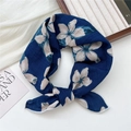 Navy blue floral cotton linen scarf tied in a bow with white flower print - Blue Quince Floral