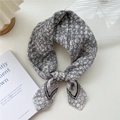 Chic black and white floral square scarf tied in a bow on a minimalist desk - 12 Stripe Base-Silver Flower Beige