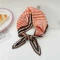 Pleated square scarf in orange and brown patchwork design tied as a decorative bow - Brown Orange Maze Pattern