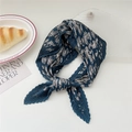 Navy blue pleated scarf with white paisley pattern and silky texture in a knotted style - Navy Sun Butterfly Paisley