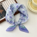 Elegant cotton linen scarf with blue floral patterns and purple border in a knotted style - Crocus Duo Frame