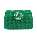 Close-up of emerald green crystal clutch bag with ornate floral rhinestone buckle - Green