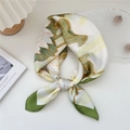 Green and white floral silk scarf with lily pads and blooming flowers tied in a knot - 14 Lotus Leaf Green
