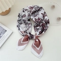 Elegant floral silk square scarf with pink borders and butterfly print in a lifestyle setting - 15 Butterfly Flower Lotus Pink