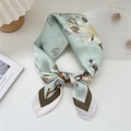 Light green silk scarf featuring white magnolia floral prints and a contrasting border - 19 Budding Bloom Green