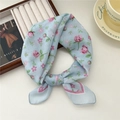 Light blue floral cotton linen square scarf with pink roses in a knotted style - Rose Green Leaf Blue