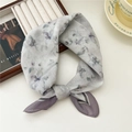 Floral silk square scarf in light grey with purple flowers tied in a bow - Ink Flower Print Purple Edge