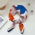 Floral print square silk scarf in blue and orange knot display for neck accessory - 29 Hundred Branch Lotus Orange Blue
