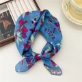 Blue floral printed lightweight scarf tied in a bow with artistic floral pattern - Faulted Flower Blue