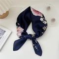 Navy blue silk scarf with pink floral pattern elegantly knotted on creamy background - 32 Long Branch Peony Navy
