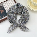 Floral cotton linen square scarf tied in a knot, styled with a magazine and coffee cup - Little Cosmos Beige