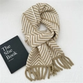 Detail of winter knit scarf with khaki chevron pattern and soft fringed edges - Khaki