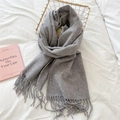 Close-up of light grey wool scarf texture and elegant fringe details in a cozy basket - Tassel Style / 46*195cm / Light Gray
