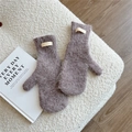 Close-up of thick mocha brown plush mittens featuring long-fiber texture and fabric label - Purple Grey