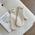 Detail of beige knitted mittens featuring soft fleece texture and ribbed cuffs with leather tag - Off-white