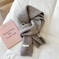 Detailed close-up of grey knitted scarf texture with logo tag and care label - 20*155cm / Starry Light Grey