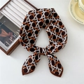 Brown and orange geometric stripe silk scarf tied in a bow with elegant French decor - Color Woven Orange