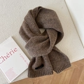 Detailed macro view of dark brown mixed wool knit scarf with 100% wool label and ribbing - Speckled Brown