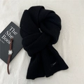 Detail of black wool knit scarf texture with a 100 percent wool label on off-white fabric - 22*160cm / Black