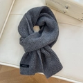 Detailed texture of thick dark grey wool scarf with 100% wool label on leather surface - 22*160cm / Dark Gray