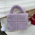Detail of lavender plush tote bag with cross-quilted design and soft faux fur texture - Purple