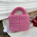 Detailed view of pink plush quilted handbag with soft four-grid pattern and fluffy handle - Rose Red