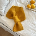 Detail of ginger yellow knitted scarf featuring textured pineapple stitch and cross-loop - Ginger Yellow