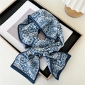 Blue and white baroque floral pattern skinny silk scarf tied in a bow on a white frame - Baroque Blue and White Floral