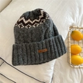 Detailed view of thick dark grey knitted hat with leather patch and geometric pattern - One Size / Textured Grey / Gray