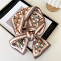 Narrow silk scarf tied in a bow with orange and green geometric weaving patterns - Woven Geometry Orange Green