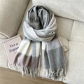 Close-up of thick wool scarf featuring grey plaid pattern and delicate tassel details - Wool Single Line Plaid Gray