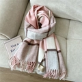 Detailed view of pink and grey checkered wool scarf with soft tassels on beige fabric - Wool Single Line Plaid Pink