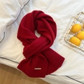 Close-up of red ribbed knit scarf showing texture and metallic brand label detail - Red - Metal Label Style (30*160cm)