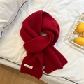 Detail of red wool scarf texture with 100% wool material label on white fabric - 20x155cm / Red (11 WOOL Label)