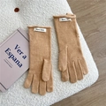 Detail of camel knitted gloves with button accent and woven label on soft fleece - One Size / Camel