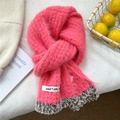 Detail of pink knitted scarf featuring faux fur trim and branded woven label tag - 20cmx152cm / Pink